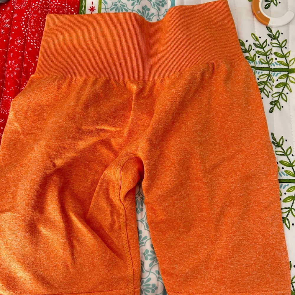 NVGTN Vibrant Orange Athletic Shorts
